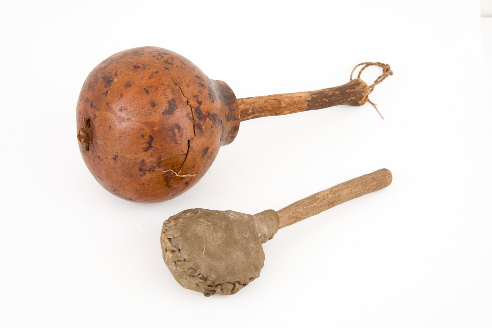 NATIVE AMERICAN GOURD & BUCKSKIN RATTLES: 9 inches. 6533