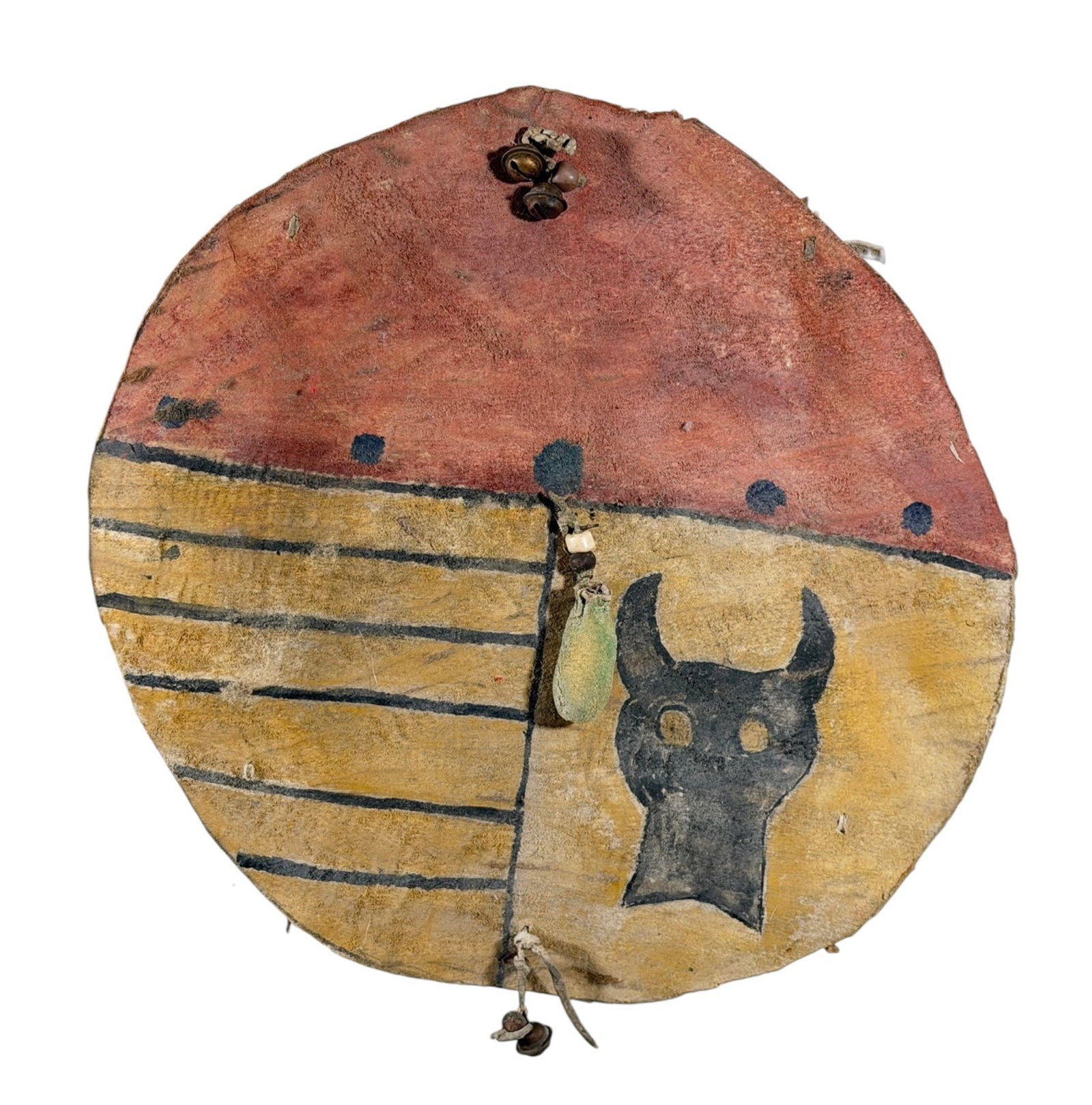 SOUTHWEST/PLAINS INDIANS PAINTED RAWHIDE SHIELD: (19th/20th c) Southwest/Plains Indians rawhide juvenile shield paint decorated with bison skull & brass bells. 11 inches.