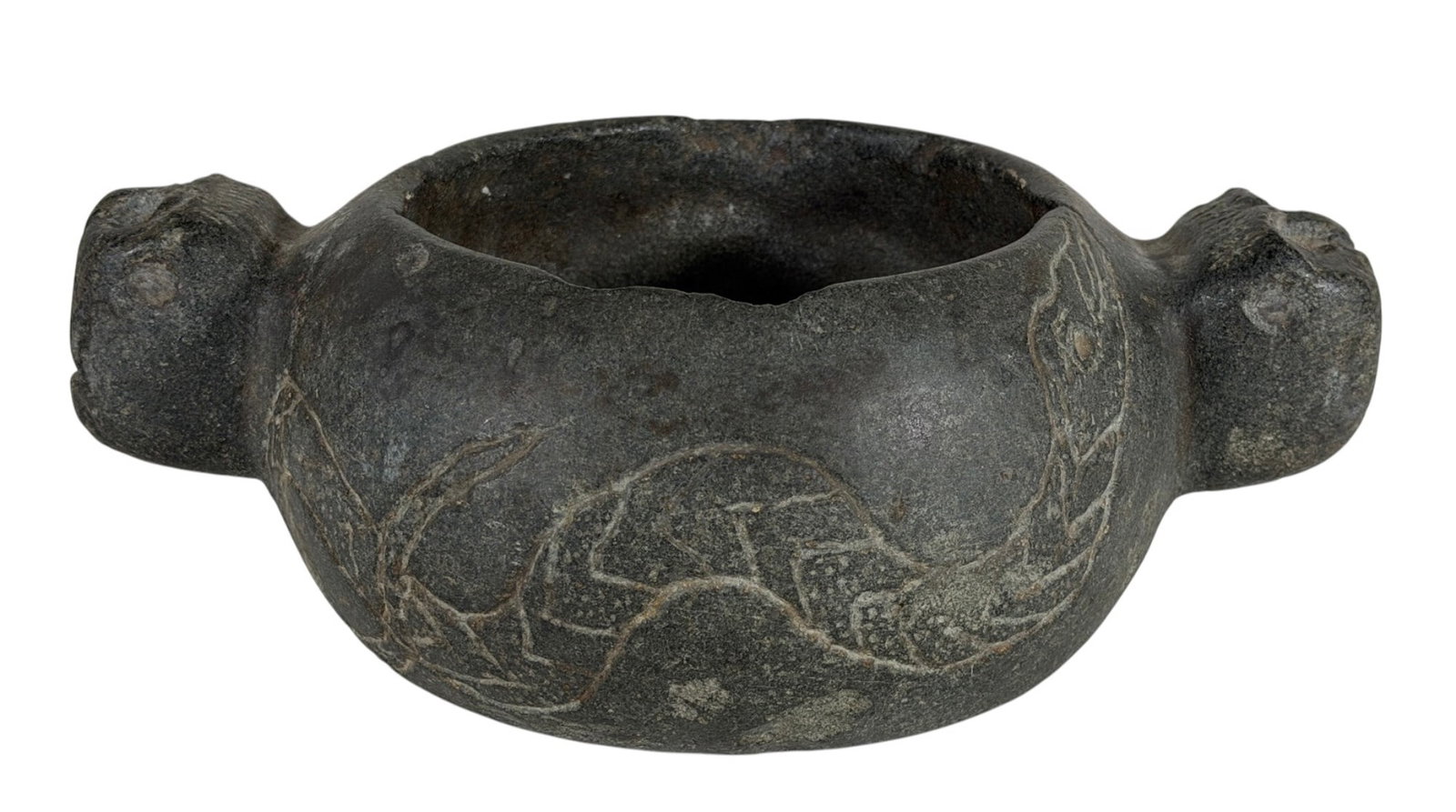 PRE-COLUMBIAN CARVED STONE MORTAR: With figural handles & carved serpent. 3 1/2 x 9 x 6 inches.