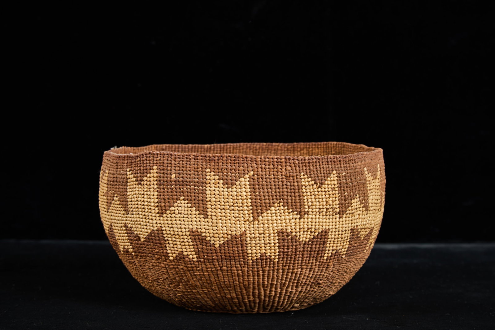 VINTAGE PACIFIC NORTHWEST NATIVE AMERICAN BASKET: Handwoven with geometric design. 3 3/4 x 7 inches.