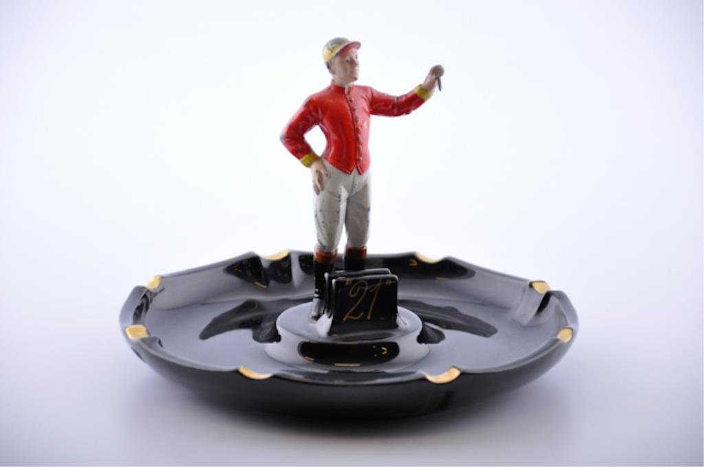 Vintage "21 Club" Ashtray: An ashtray from world famous "21 Club" in Manhattan signed "Hall" with metal jockey on porcelain tray. 9 inches (diameter) Condition: Good some loss to jockey paint