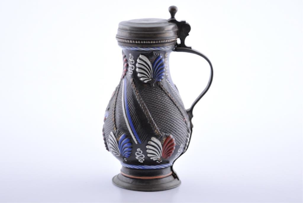 Early Stoneware Muskau Stein: Salt Glazed German Beer Stein with elaborate decoration. Pewter fittings marked " I.L., 1686" , interior lid with three touch marks and the name "Abraham Krubel" in cursive. Black ground decorated in 
