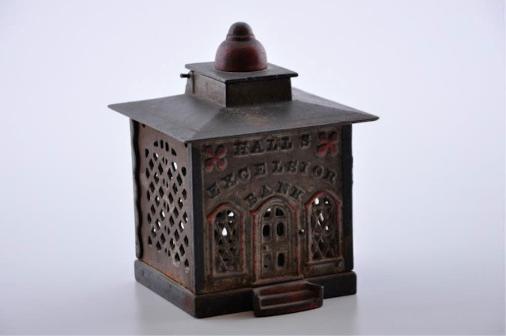Cast Iron "Bank" Bank: Still Bank " Hall's Excelsior Bank". 5 1/4 inches (height) Condition: Good with paint loss