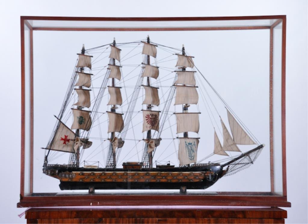Spanish Galleon Ship Model: Folk-carved fully rigged four masted war ship in a glass presentation case. 32 x 46 x 12 inches Condition: Good