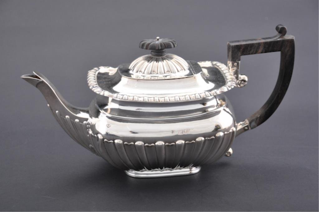 Sterling Silver London Teapot: Teapot with marks for "London, 1902, makers George Jackson & David Fullerton" stamped on bottom "Benetfink, Cheapside E.C." . 11 1/2 x 5 1/2 inches. Weight with handle approx. 18 troy oz. Condition: G