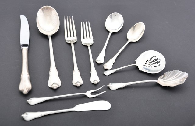 Wallace & Co. Sterling Flatware Service: (54) Piece Grand Colonial Pattern. Not monogrammed. Manufactured by Wallace and Company. 56.7 troy oz. Condition: Good. Shows little wear.