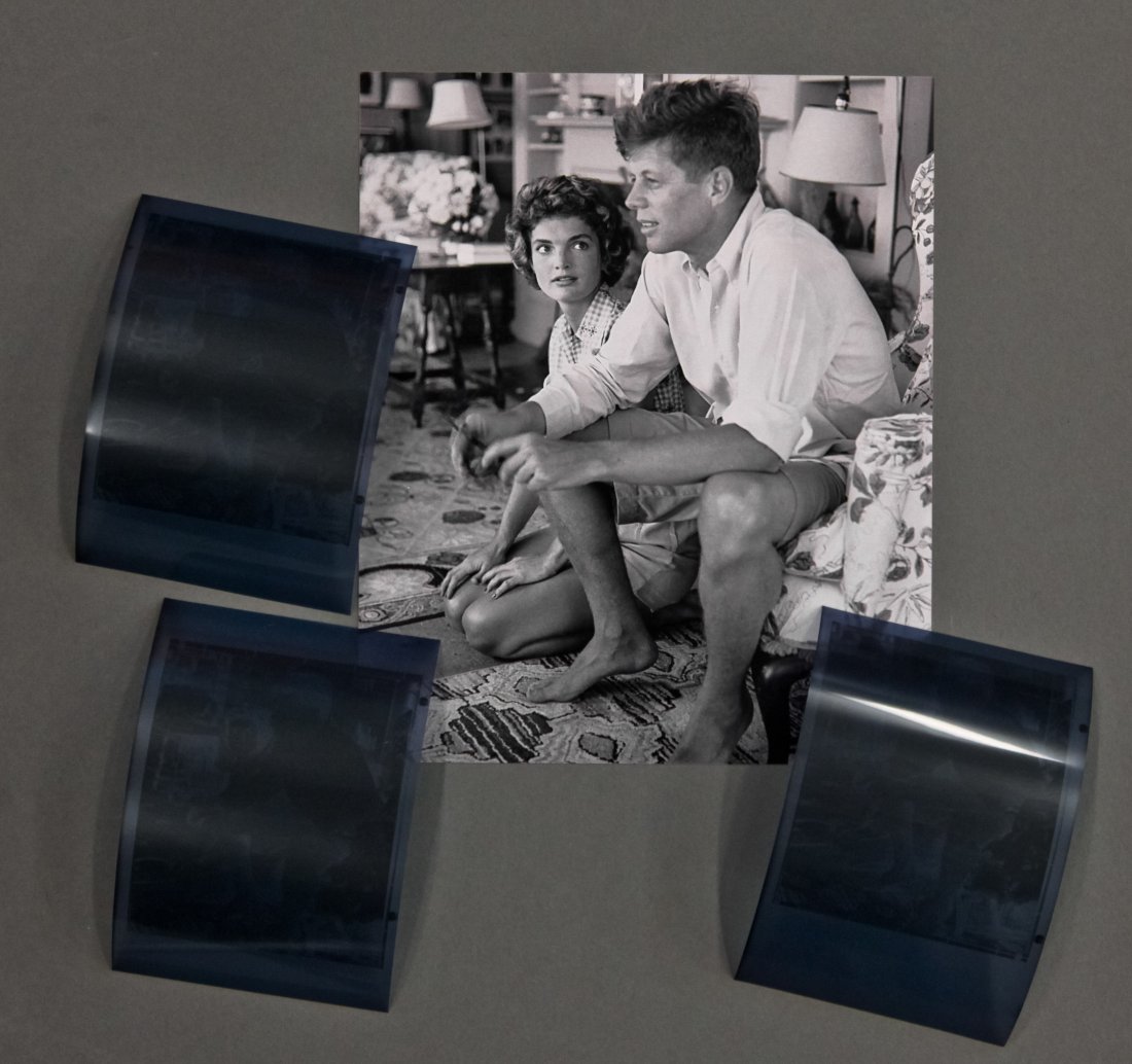 Engagement photos: John F. Kennedy & Jackie: (3) Hy Peskin (1915-2005) photographs: (3) negatives and (1) photograph reprint of John F. Kennedy and Jackie in the living room, negatives 3 3/4 x 2 1/2 inches.