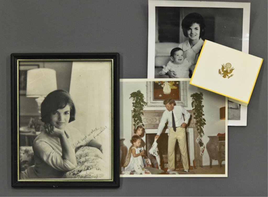 Kennedy Family Photos & Card Signed Jackie: (1) Photograph of Jacqueline Kennedy inscribed "With best wishes, Jacqueline Kennedy", 8 x 10 inches, framed, (1) photograph of Jacqueline Kennedy sitting on the floor holding Caroline and John Kenned
