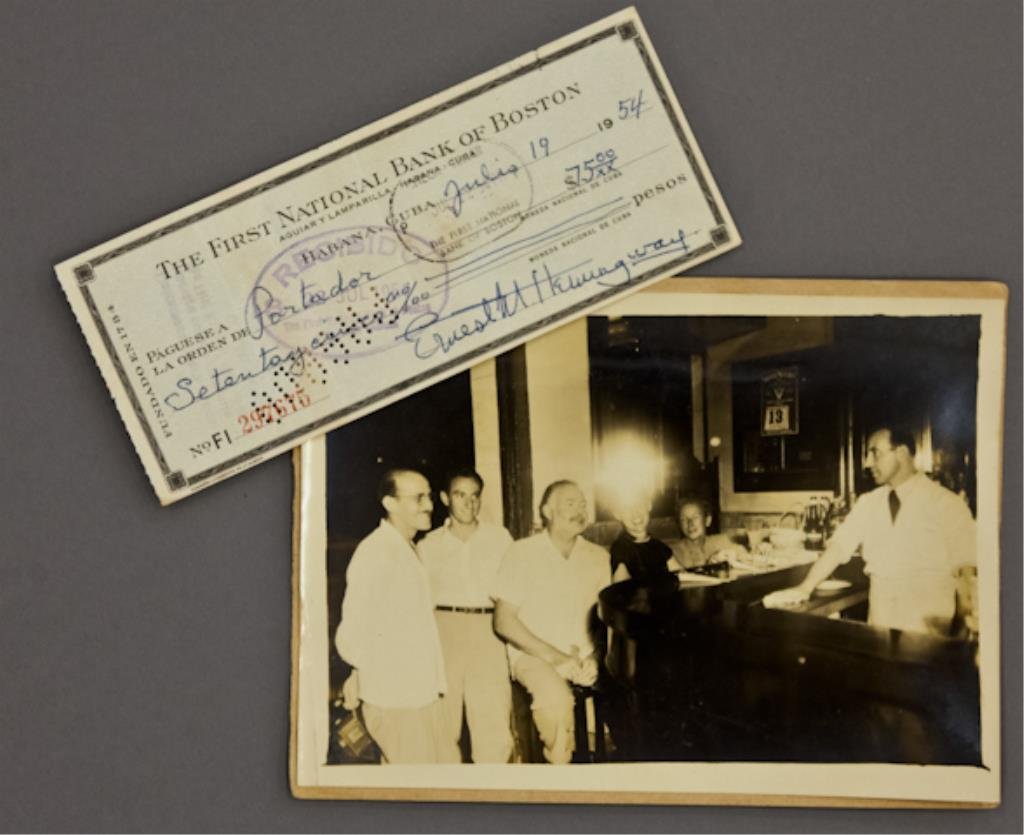 Ernest Hemingway Signed Check: (1) Bank check filled out and signed in ink "Ernest M. Hemingway" payable to Portador for $75.00 dated July 19 1954, endorsed "Roberto Herrera", 2 3/4 x 6 3/8 inches, together with (1) photograph of (