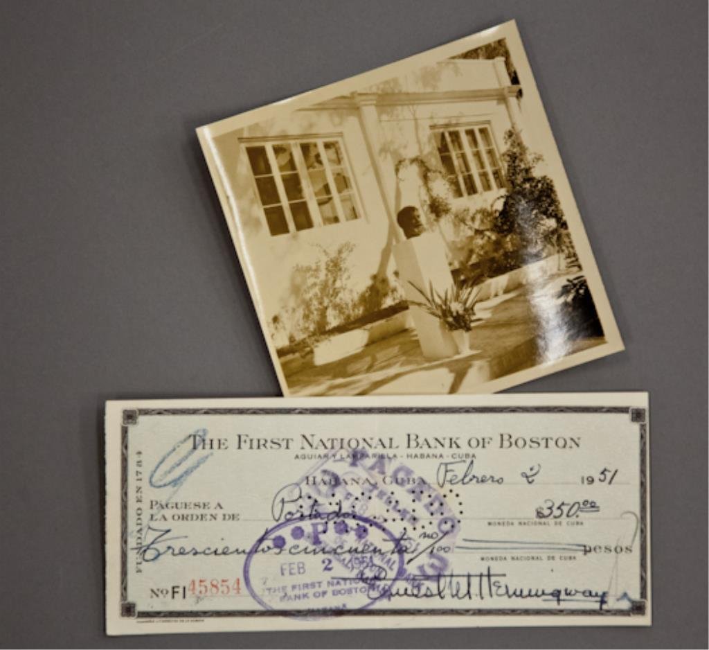 Hemingway Photograph & Signed Check: (1) Bank check filled out and signed in ink "Ernest M. Hemingway" payable to Portador for $350.00 dated February 2 1951, endorsed "Roberto Herrera", 2 3/4 x 6 1/4 inches. (with expected cancellation h