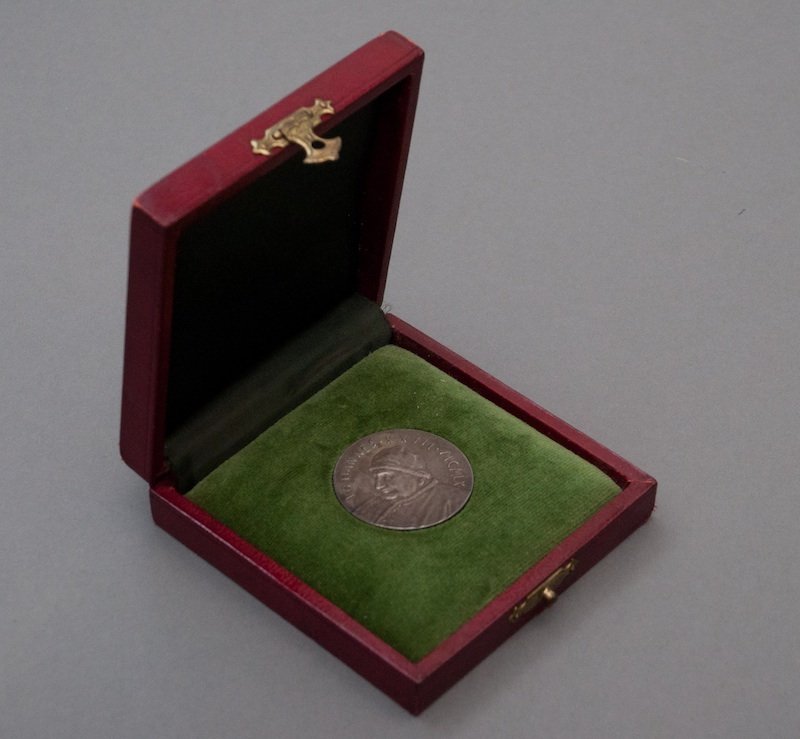 Pope John XXIII Coin Given to Jackie: (1) Medal commemorating Pope John XXIII, inscribed "Johannes XXIII MCMLX" and "Oboedien Tia Et Px" verso, with the original oxblood leather presentation case embossed with the Papal Coat of Arms. Jack