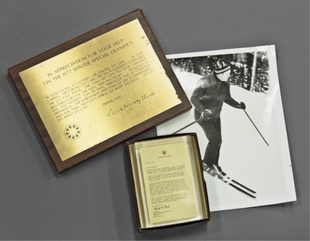 Gerald Ford Paperweight and Olympics: (1) Gerald R. Ford paperweight in box, dated April 21, 1983. (1) photograph of Gerald Ford on skis, 10 x 8 inches, (1) plaque of appreciation for help on the 1977 Winter Olympics, Eunice Kennedy Shriv