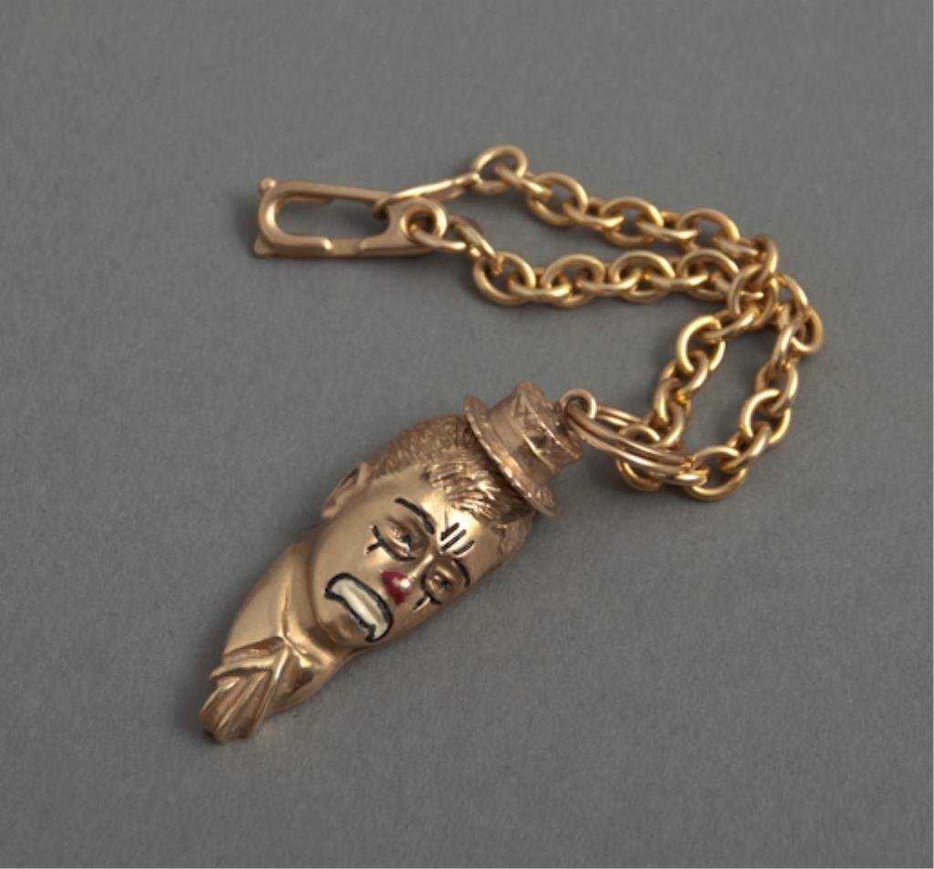 14k Gold Jerry Lewis Clown Charm: (1) 14k gold charm on clasped chain which depicts Jerry Lewis in a sad clown face after "The Day the Clown Cried" (a 1971 Jerry Lewis film) *Note: This was a gift to Milt Ebbins from Jerry Lewis who s
