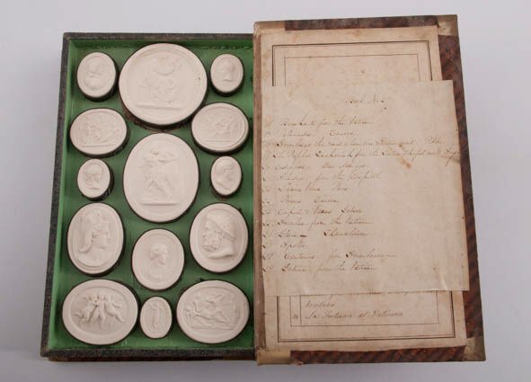Volume 5 Liberotti Impronte Plasters: A single volume of Liberotti Impronte plasters done for "Grand Tour" tourist trade in early nineteenth century Italy. Plaster cameos depict mythological scenes and European works of art. Some scruffs