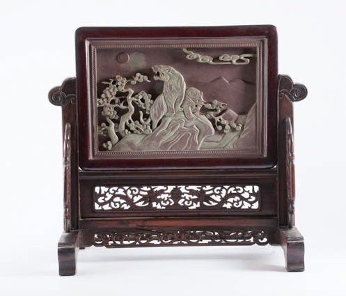 Chinese Rosewood Table Screen: Carved rosewood screen with carved slate panel depicting two lions. Panel is removable. 17" high x 19" wide overall. Condition: Some fretwork damage at base of stand.
