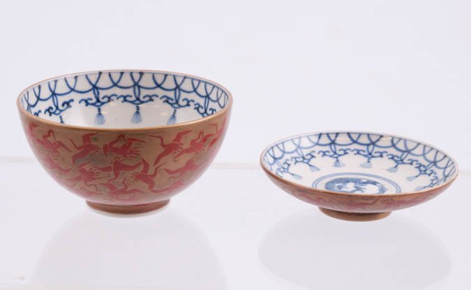Chinese Dragon Bowl and Saucer: Inner is blue on white decorated with dragon center; outer is red on gold bird decoration, marked underneath; bowl, 4 1/4" diameter, and saucer, 4" diameter. Condition: Good