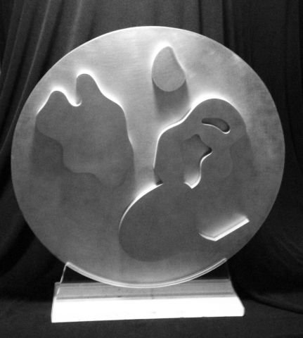Jean Arp (1887-1966): Composition dans un Cercle no. 5. Aluminum 15. Wonderful surface on metal never touched or cleaned, signed and numbered on the back, retains original Lucite stand. Both pieces have the original paper