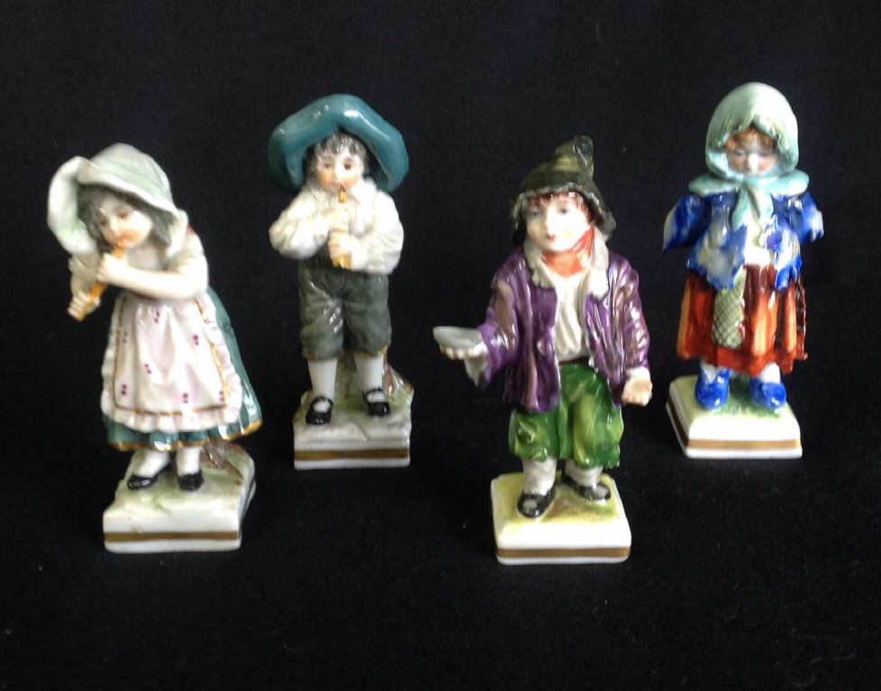 4 Capodimonte Porcelain Children: 2 musicians and 2 tramps.