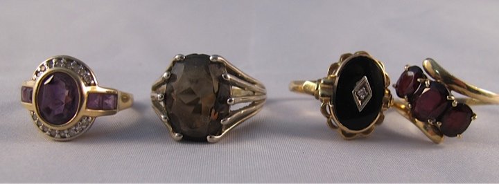Group of Gemset Rings: onyx, amethyst & garnet rings are 14K yellow gold, smokey quartz is set in 10k white gold. Weight is 13.1 dwt. Condition: Good