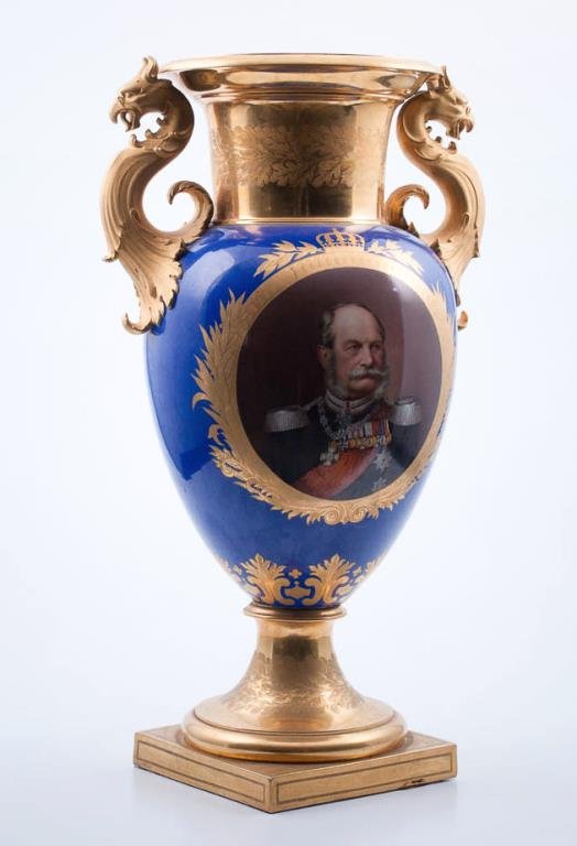 KPM German Porcelain Portrait Vase: With fancy qilt gargoyle form handles. The vase depicting a portrait of Kaiser Wilhem II. Surrounded by fancy gilt border and royal blue body on gilt pedestal. Approx. 28"