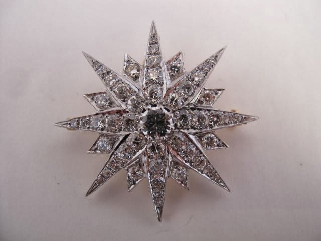 Victorian Starburst Diamond Pin: 14K gold Victorian starburst pin/pendant set with 49 old European cut diamonds of good color and clarity and very good scintillation. Top is white gold and edges are millgrained, diamonds are set clos