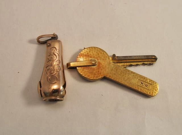 Tiffany Key Cover with Cigar Cutter: 14K gold Tiffany key cover with a gold cigar cutter. both are monogrammed Condition: Good
