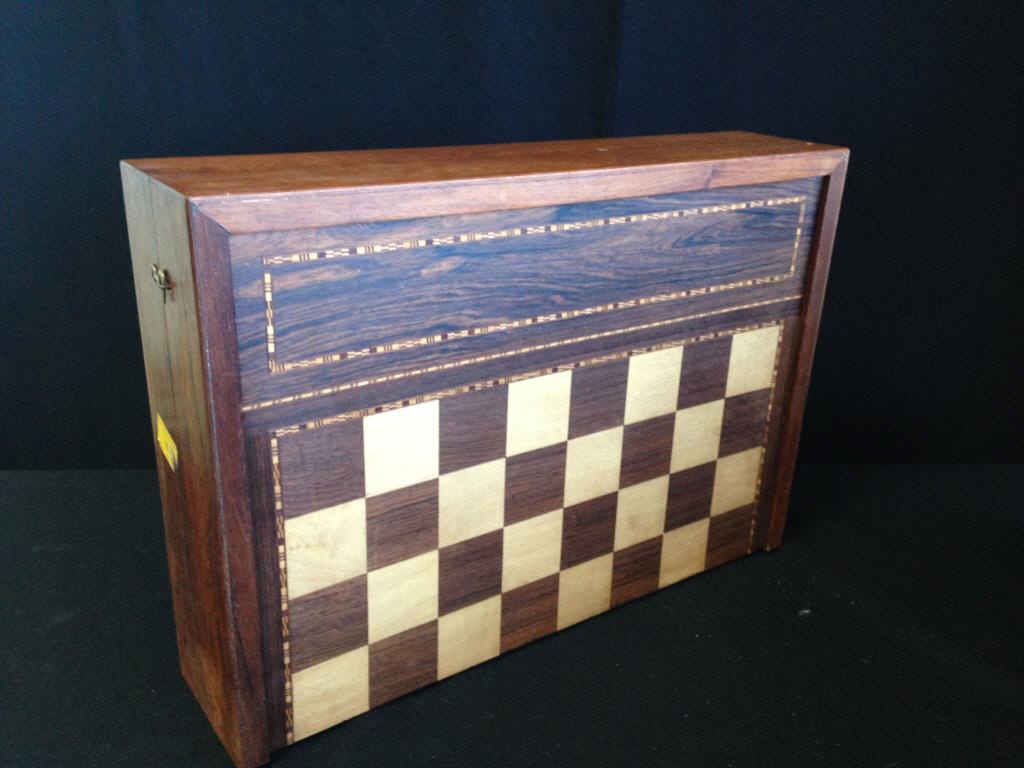 Game Board: Opens to backgammon set with pieces. Inlaid with exotic woods. Oversize 21" x 14" x 5" closed.