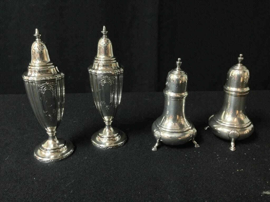 Sterling Salt & Pepper Shakers: 2 pairs of sterling silver salt & pepper shakers. 6 inches and 5 inches. 8.5 Troy ozs Condition: Good
