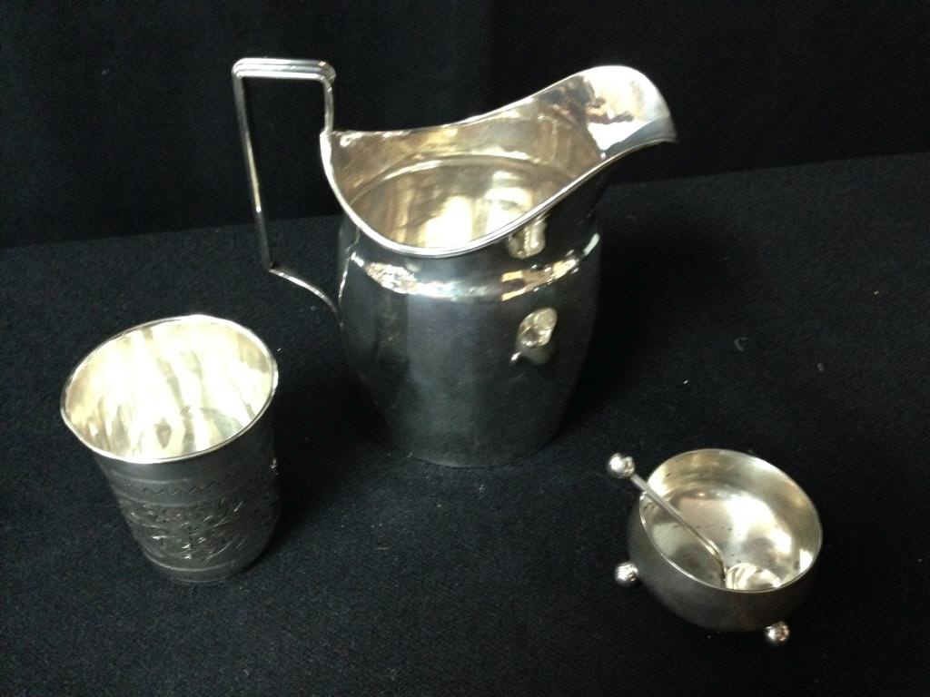 Sterling Pitcher w/ Other Items: Sterling silver pitcher , a sterling cup and a sterling salt with spoon. 6.5 Troy ozs Condition: good
