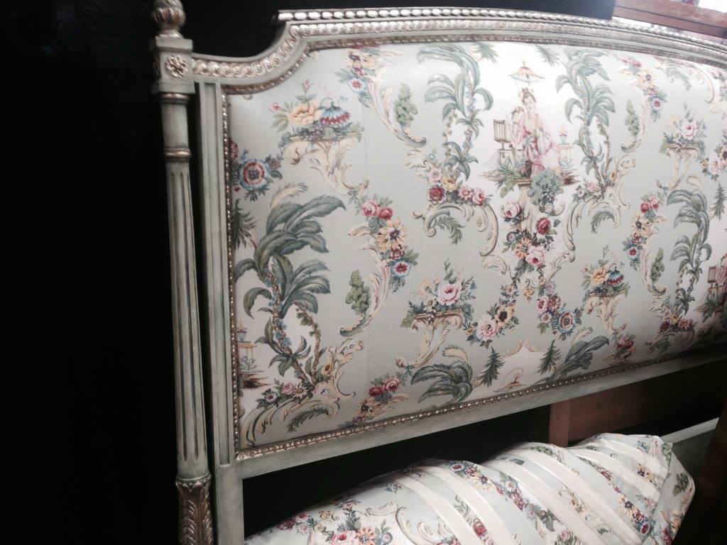 Decorator King Headboard: Custom, carved and painted silver and green wood frame, upholstered in floral patter with coordinating drapery panels.