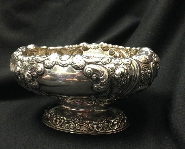 Centerpiece: Hand chased and repousse sterling silver centerpiece bowl by Alexander & Sons, Glasgow Scotland. 24 Troy ozs.