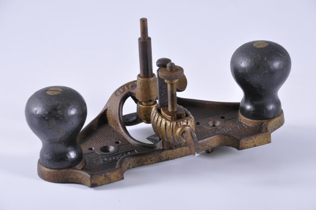 Stanley #71 Router Plane: Complete with a depth gauge and an adjustable fence attached to the bottom. There is light rust on the top and continues onto the bottom. No pitting. Condition: fair