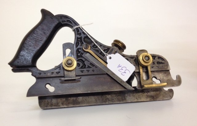 Millers Patent Plow Plane: Millers #41 patent adjustable metallic plow plane. The rosewood handle has a stamped patent date on the left side June 28, 1870 The metal skate has two screw holes for a fillester cutter which is miss