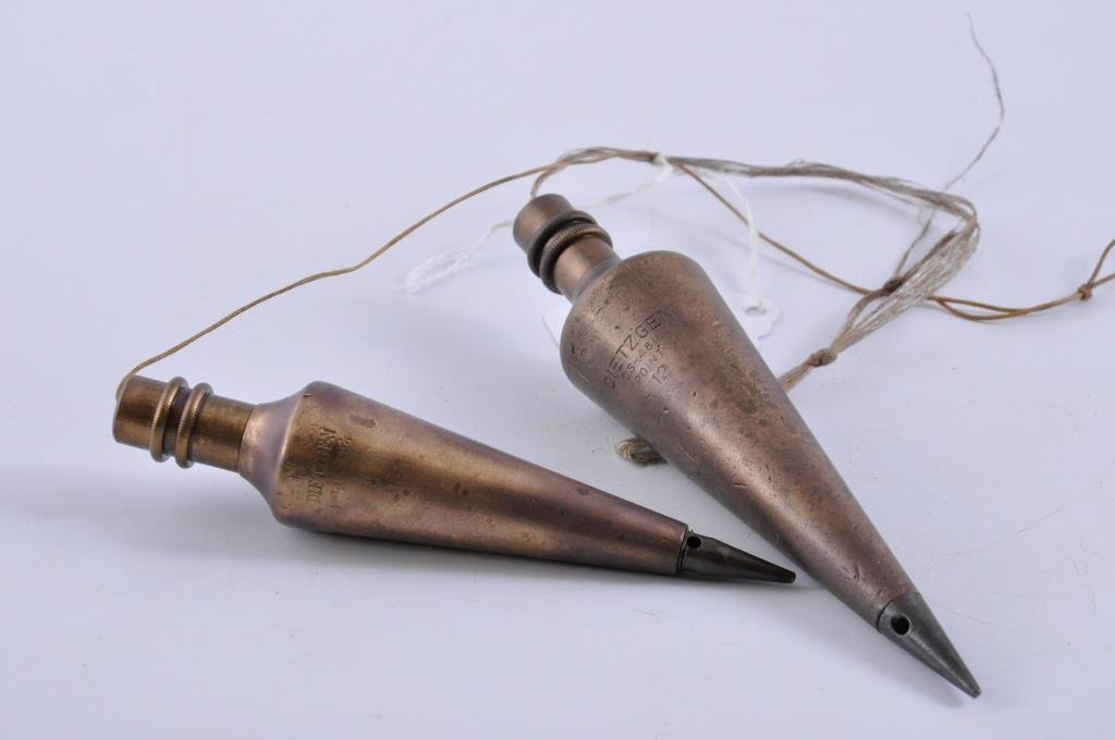 Two Dietzgen Plumb Bobs: The larger plumb bob measures 5 1/2” long and is 12 ounces, #CS-4811. The smaller plumb bob measures 4 3/4” long #82425 and is 8 ounces. Condition: good