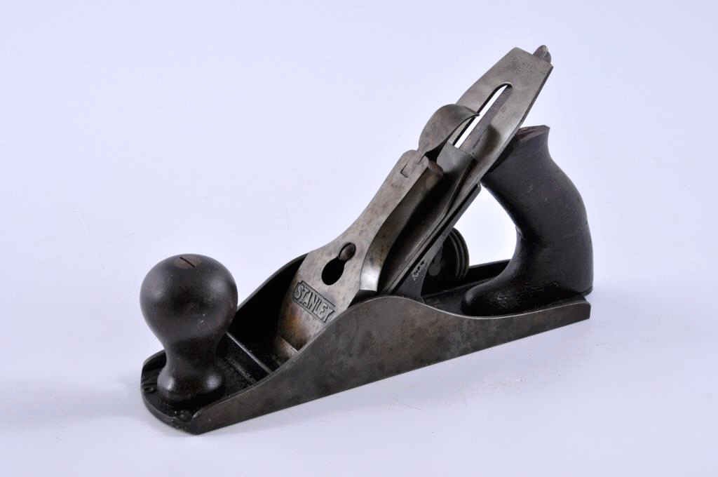 Stanley Bailey #3 Plane: Stanley Bailey #3 plane with a patent date of April 19th, 1910. The front knob is in excellent condition, and the rear handle is cracked all the way through and missing the top. Condition: fair