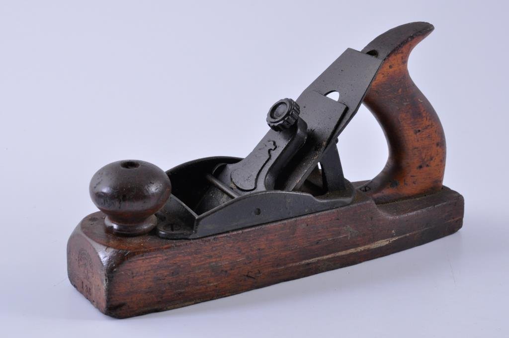 Stanley Rule and Level Company Wood Bottom Plane: 10” x 2” Stanley plane #135, with a clear company stamp on the front. Condition: good