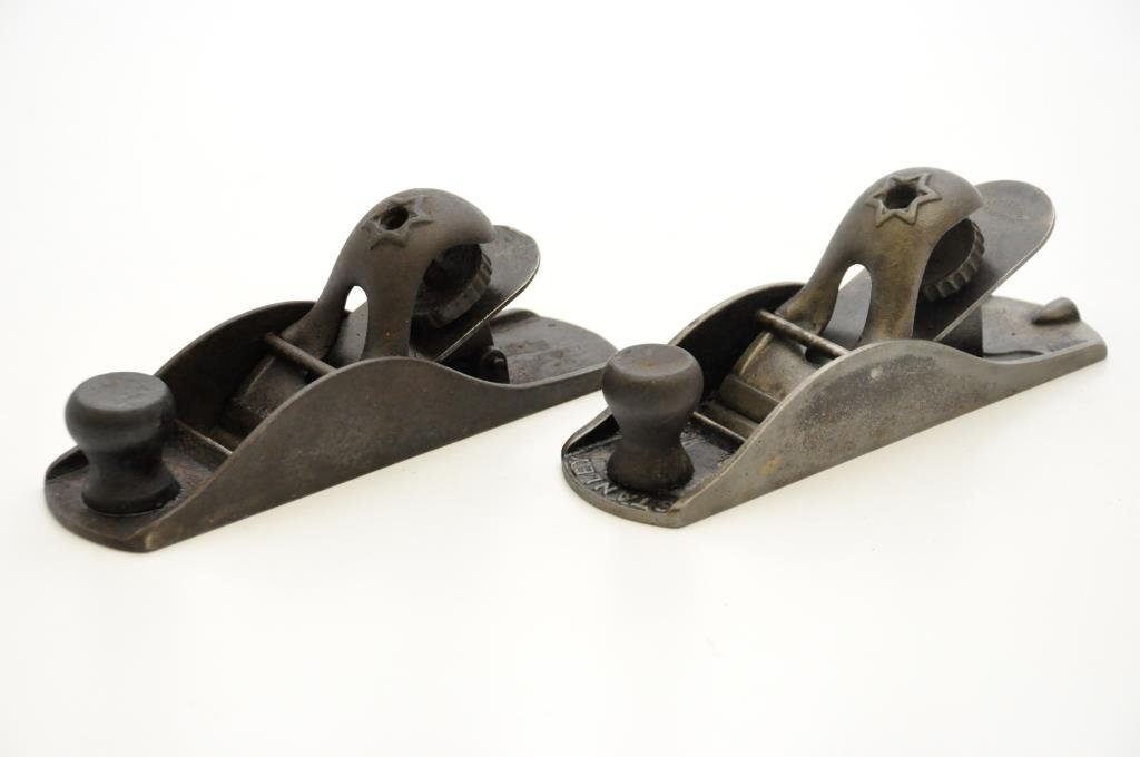 Two Stanley Block Planes: Two Stanley block planes #120 type 1. The lever caps each have a six pointed star. One cap appears to be a bronze replacement and the left side of the same plane has a repair. Condition: fair