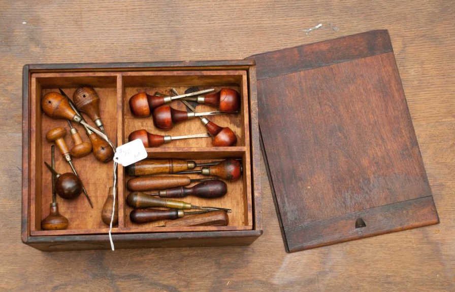 Box Lot of Gravers Tools: 12 1/2” long box with a 'Wella' emblem, containing approximately 20 gravers tools used by silversmiths or watchmakers. Condition: good