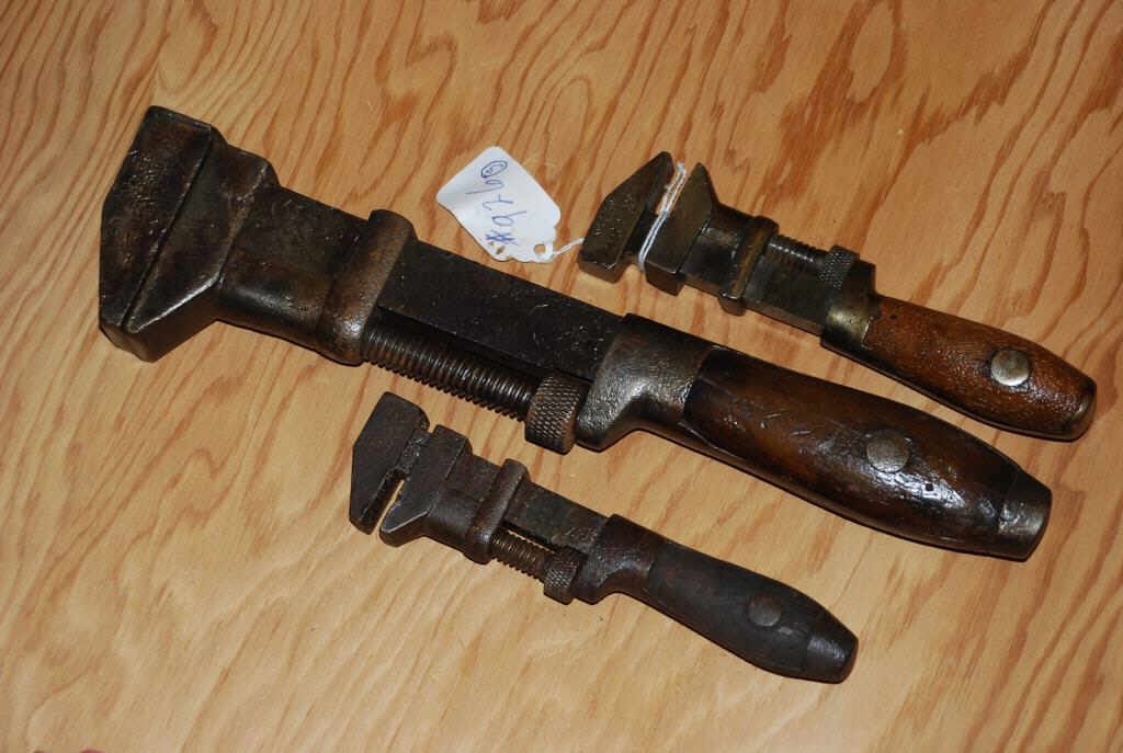 Three Coes Wrenches: Three stamped 'Coes' wrenches. One wrench has a patent date of July 6, 1880. Another has a patent date of July 8, 1884. One of the small wrenches has a small break in the metal. The largest measures 1