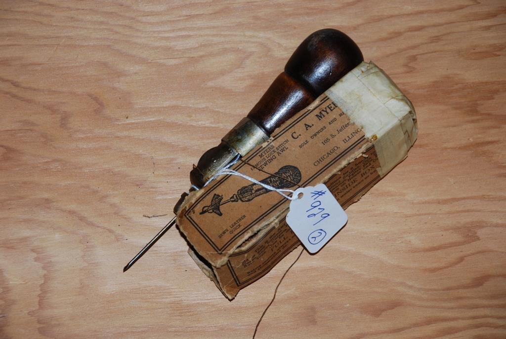Two Leather Awls: Myers patented sewing awl. One in the original box with instructions. Each have screw tops with extra tools inside. Condition: good