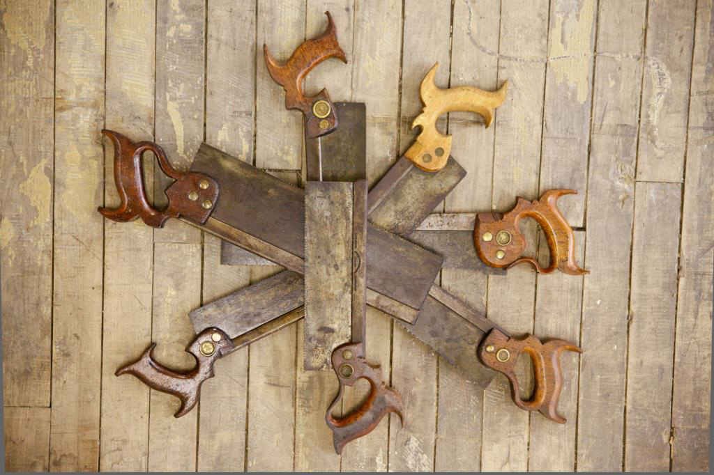 Lot of Back Saws: Seven metal back saws. One saw is marked 'Henry Disston & Sons.' The longest saw measures 18 1/2”. Condition: good