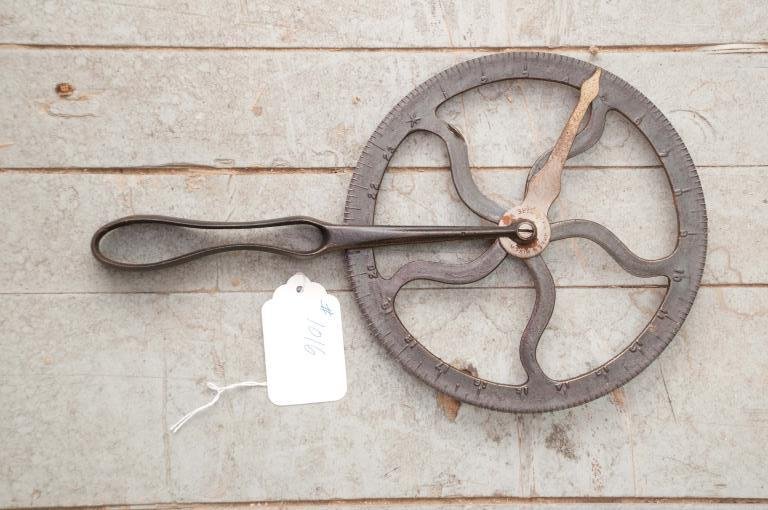 Traveler: Made by the Green River Co. this metal traveler was used by a Wheelwright and or a Blacksmith to measure the circumference of a wagon wheel and the metal tire. Condition: Very good