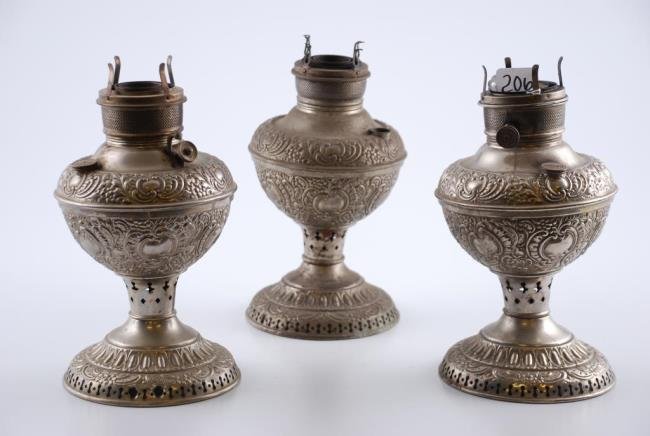 (3) Similar Nickel Plated Fluid Lamps: (3) Similar Nickel Plated Fluid Lamps, (1) marked Miller's Vestal, (1) marked the Gaskell Lamp, and (1) unmarked. Height 11 inches. Condition: Tarnish, surface grime, wear, minor dents, missing chimne