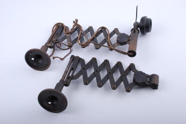 (2) Accordion R/R Depot Wall Scissor Mounts: (2) Scissor mounts (1) with candlestick and wire. Each circa 1915. Brand unknown. Condition: Incomplete, (1) missing phone, (1) missing earpiece etc.
