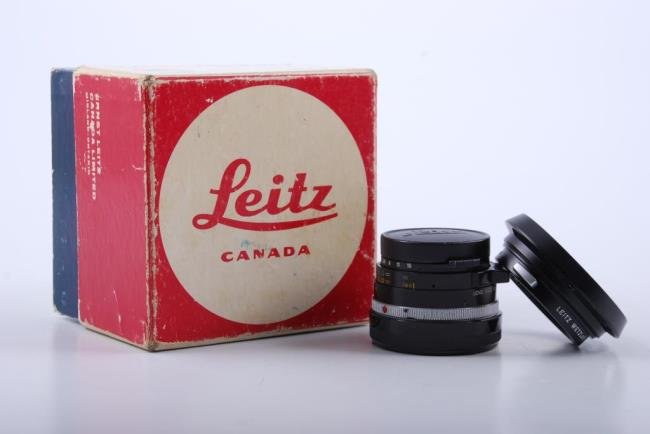 Leitz Leica 35mm Summilux 1:1.4 Lens: Leitz Leica Canada 35mm Summilux 1:1.4 Lens with original box. Condition: Used condition. Clean optics, needs calibration.