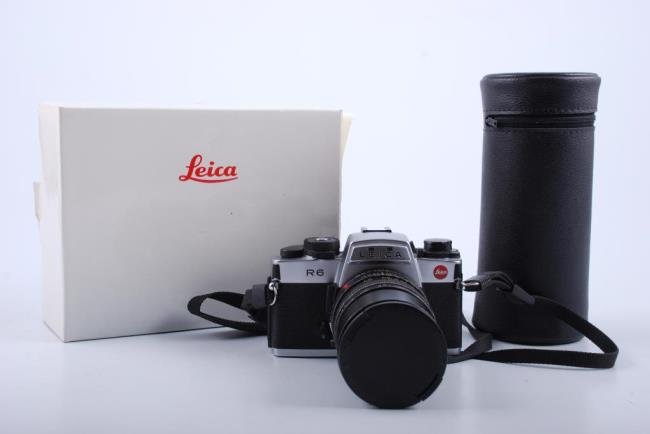 Leica R6 SLR Film Camera & Lens Lot: Leica R6 SLR Film Camera in original box. Comes with 100mm Macro - Elmar - R 1:4 and a 70-210mm lens. Condition: Camera is in good clean used condition. Both lenses have clean optics. May need calibra