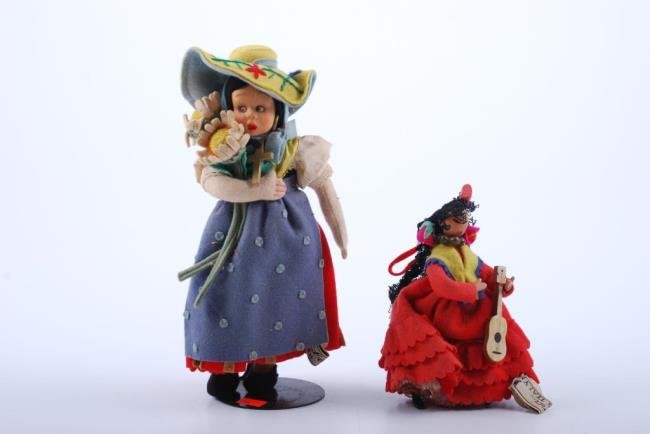 Lenci Girl with Sun Flowers and a Smaller Spanish Lady: Original tags small Lenci Spanish lady, wooden face, and guitar, labels. 10" Condition: Very good, small hole back of dress, soil to clothing; Spanish lady mantrilla tears, felt clothing ok, wooden ha