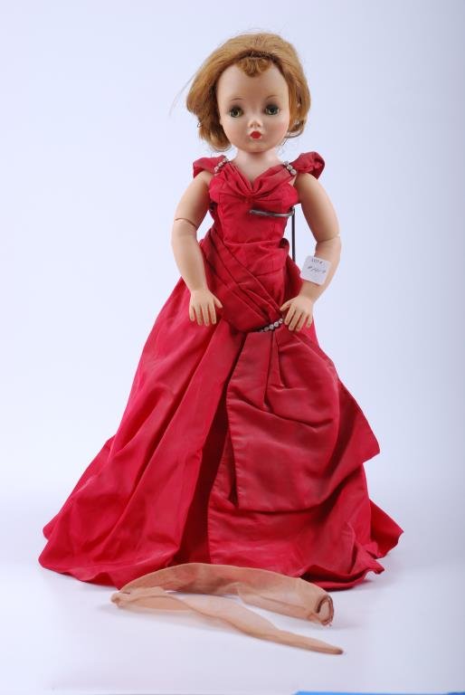 Cissy Madame Alexander doll: Wears red gown(untagged) slip & panties, nylons, no shoes, extra pair of nylons. 17" Condition: Green sleep eyes work well, soil to doll and gown has a stain on shoulder strap