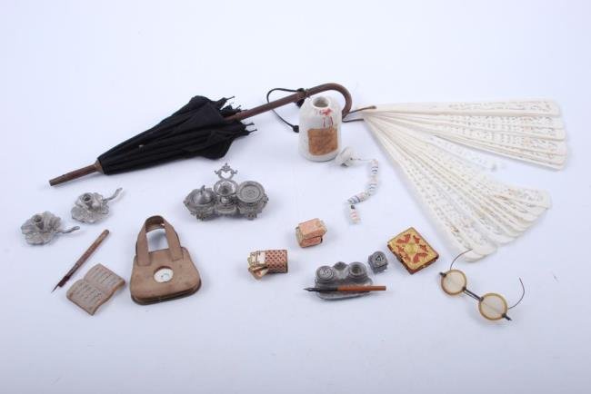 Victorian Doll and Doll House Accessories: Includes parosol two miniature decks, playing cards, reading glasses, leather purse, book, inkwell and pen, two candle sticks, bisque bottle with string of bisque dolls Condition: Very good