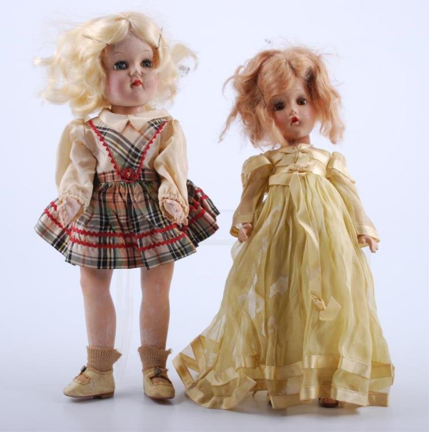 Two Madame Alexander dolls: One (1) with yellow a dress and shoes, brown sleep eyes 12". One (1) Ideal hard plastic doll with plaid dress with sleep eyes 13" Condition: Alex clothes stained, compo, plastic doll stains hair messy
